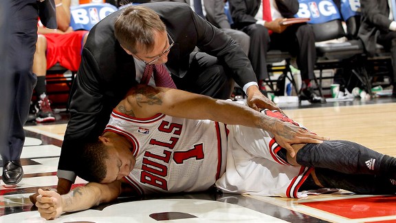 Rose lies in pain after tearing ACL in game one vs the Philadelphia Sixers