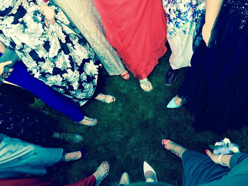 A picture taken before leaving for dinner of all of the ladies in the prom groups shoes and bottoms of their dresses, photo credit: Micaela Harris’s mother.