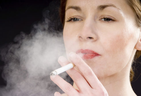 A woman smoking a cigarette. Photo courtesy of WebMD.