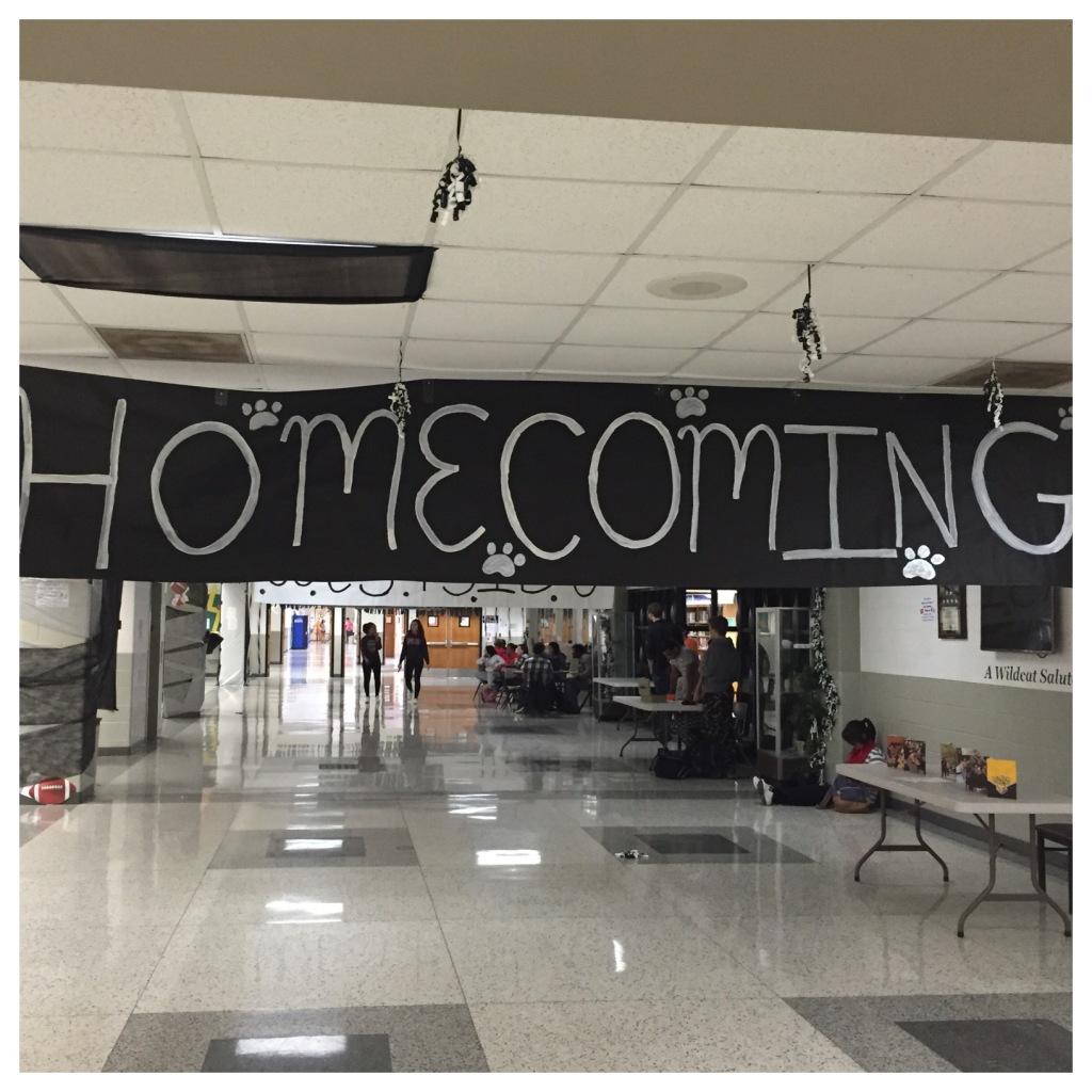 The homecoming sign hangs above the Normal West atrium in celebration of the 2015 homecoming. 