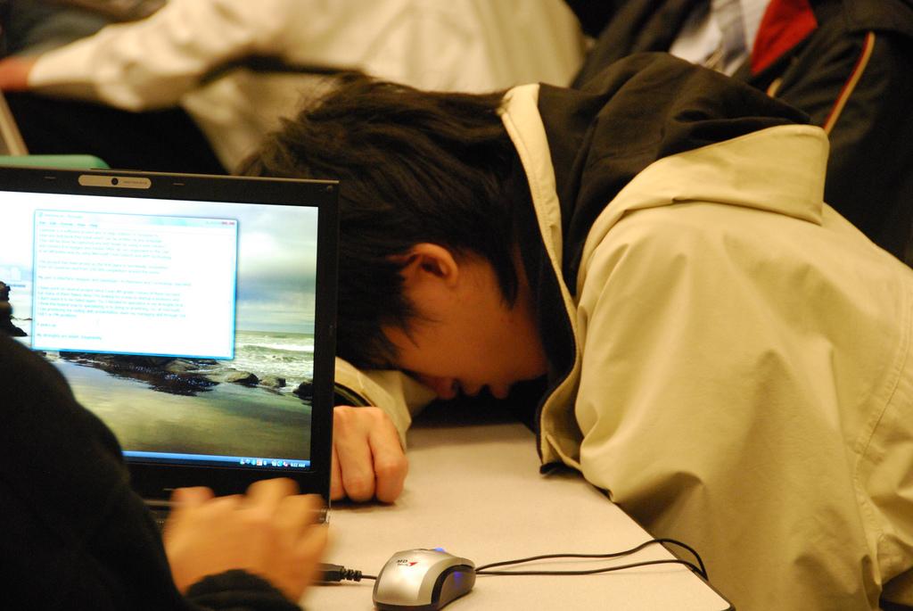 Above is pictured an exhausted student sleeping in class. photo courtesy of flickr.com.