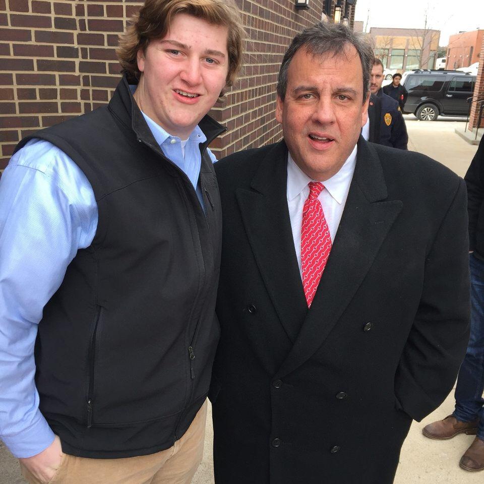 Student Council president Jon Olsen poses with presidential candidate Chris Christie. 