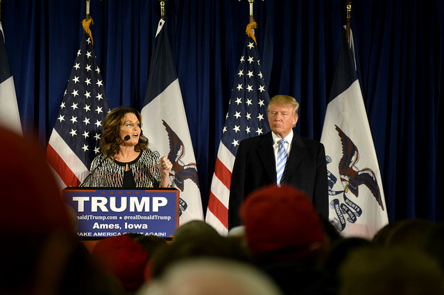 Republican presidential candidate, Donald J. Trump welcomes the former governor of Alaska, Sarah Palin to the stage of a Trump rally in Ames, IA Tuesday, January 19, 2016.