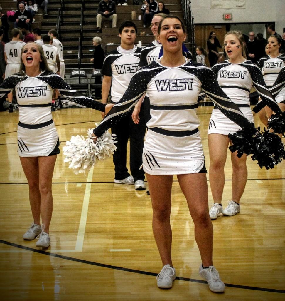 Normal West Coed Cheerleaders pump up the student section during Friday, February 26, 2016 regular season game. 