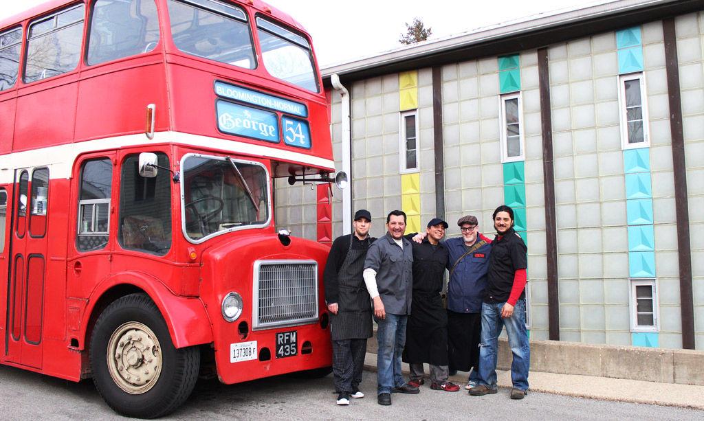 Stephan Block and the crew of George 54 pose in front of Bloomington-Normals newest bustaurant.