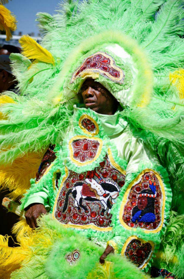 A traditional Mardi Gras Indian performs during parade.
