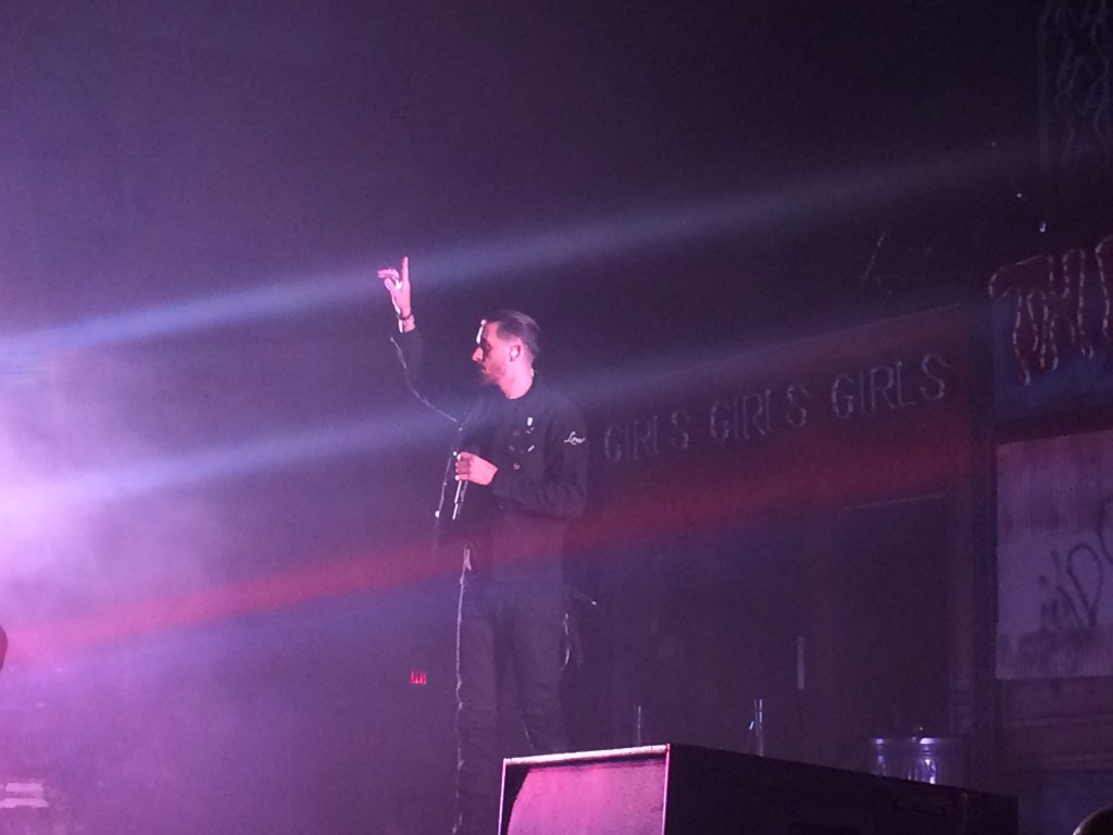 Rapper G-Eazy addressing the crowd at U.S. Cellular Coliseum during a song 
