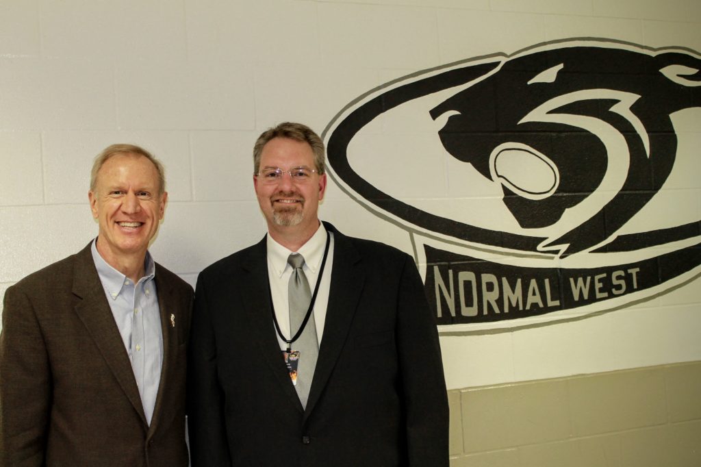 Principal Dave Johnson (right) poses with Illinois governor Bruce Rauner (left) for a picture during the governors visit to NCWHS. 