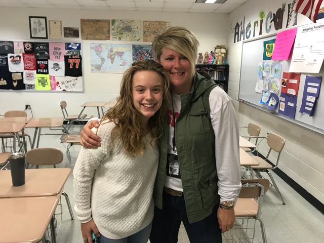 Leah Grehan and Mrs. Codron (left to right) pose together in the morning while the school song played over the loudspeaker. 