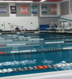 Caleb Jirik(12) completes a dive during Thursdays senior night meet against Central Catholic.