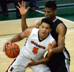 Francis Okoro(11), defends C.J. Wilbourn(11) during the intercity tournament at the Shirk Center.
