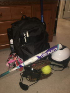 Photo of one of the players’ softball gear prepared for tryouts.  Photo by Lauren Adcock.  