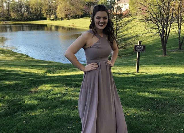 Prom expert Briana Turcotte poses before the last prom she attended in 2017 before she graduated.
