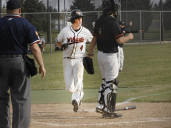 Sophomore Will Kaferr scores a run in the third inning of Thursdays game.