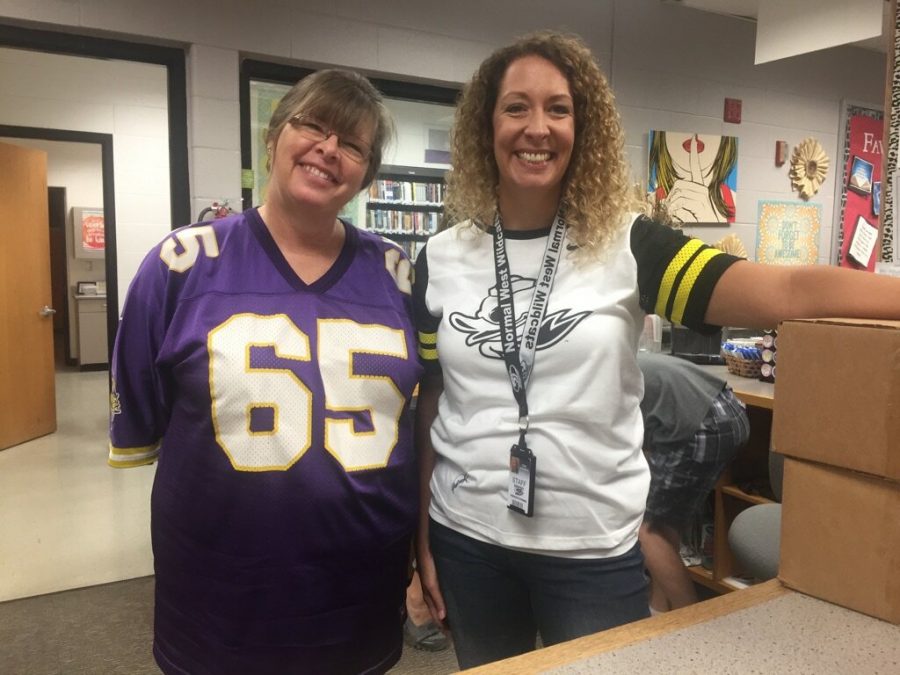 Normal West librarians Mrs. Nichols and Mrs. Hafermann celebrate jersey spirit day by flaunting their favorite teams jersey. 