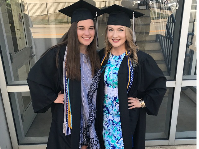 Class of 2018 graduates Sophia Downs (left) and Emma Jackson (right) after their graduation ceremony at Grossinger motors arena