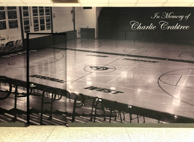 Memorial for Charlie Crabtree is displayed outside of gymnasium. 