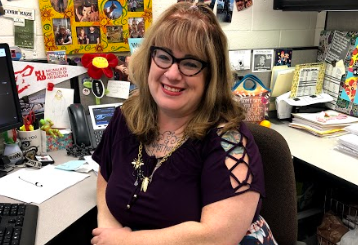 Mrs. Pasewald is the administrative assistant to the athletic director at Normal West High School.
