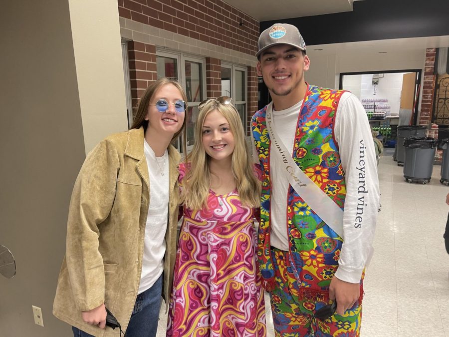 Homecoming spirit week day 3 is Decades day! Seniors Megan Williams, Lauren Nord, and Max Ziebarth (left to right) are showing off their 70s outfits.