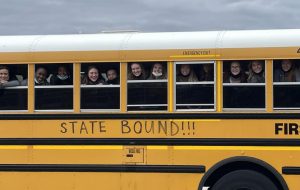 The Normal West volleyball team says goodbye as they load the bus to head to state tournament at Redbird Arena on ISUs campus.