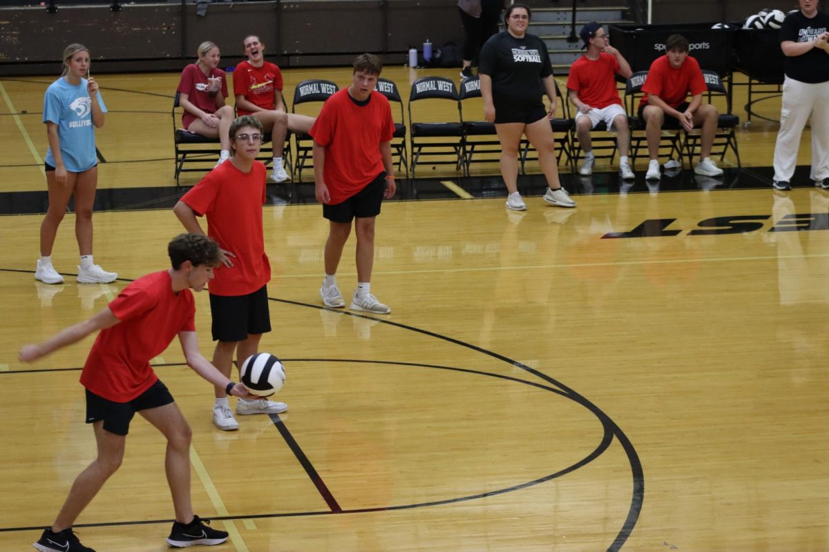 Dane Schlipmann steps back to serve against the freshmen team. The Juniors took the win in this set, but eventually lost to the seniors.