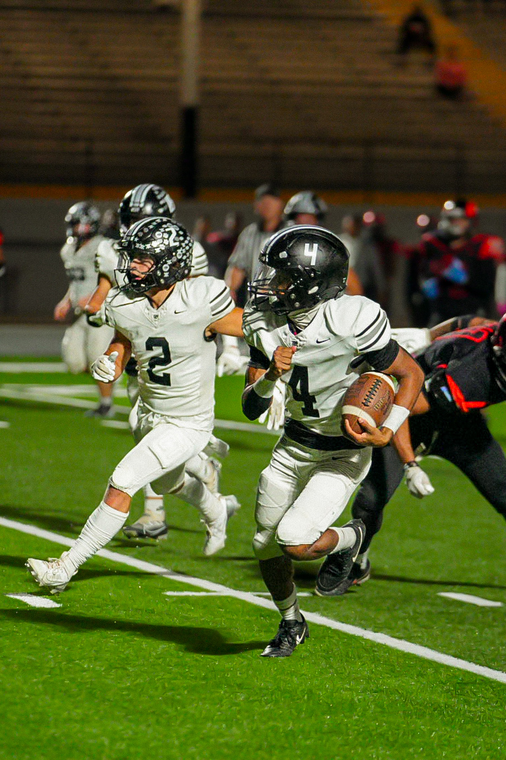 The Wildcats are getting set for the 2024 IHSA state playoffs where they will take on Simeon High School at 1 p.m. on Saturday, November 2. Above, senior Cooper Temples & Junior Maliq Givens head towards another Wildcat touchdown. Muhlbauer and Givens have been key to the Wildcat success thus far, and Coach Fincham looks to them to continue their young leadership into a postseason run.