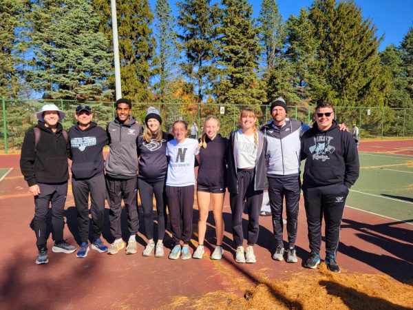 Coach Bliss, Coach Horton, Senior Zeke Rice, Coach Starkey, Juniors Renee Warren, Amanda Warren, and Julie Bach, Coach Aubin, and Coach Rogers all pose for a picture following the sectional race. These Wildcats are heading to the state championship this Saturday, November 9 at Detweiller Park. 