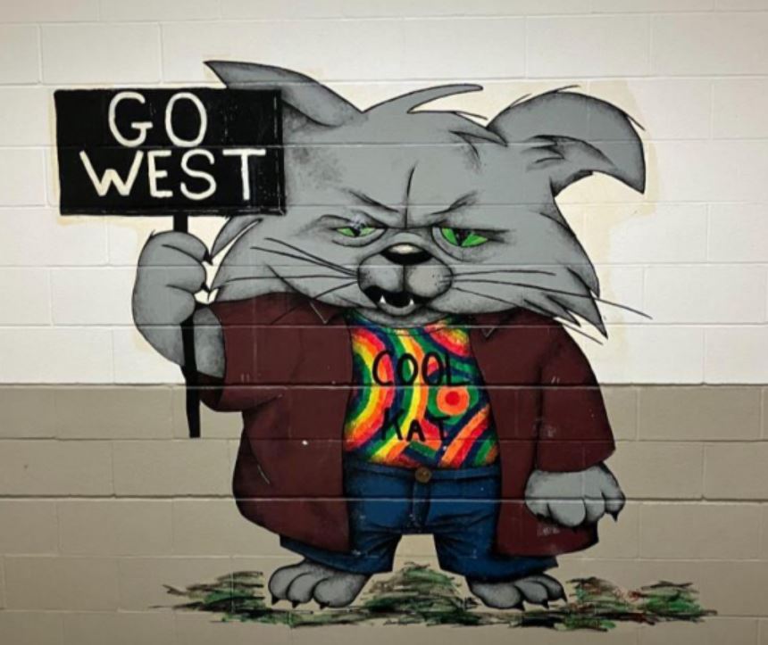 A recent campaign to re-spruce up the halls of Normal West is in progress, and one of the key pieces to be targeted are the murals that line the stairwells. These murals originated when West alum, Jenny Reithmaier used her airbrush art to create unique images. 