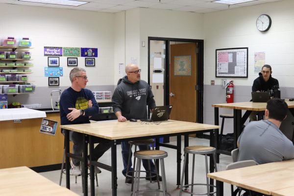 Led by the FACS, STEM, & Tech departments, Normal West will be seeing a balcony "face-lift" at the end of the school year. Above, Mr. Dave Weber and Dave Lehr, two pivotal members of the staff team to bring this project to life, discuss the execution of the plans with students in the Stem Capstone class.