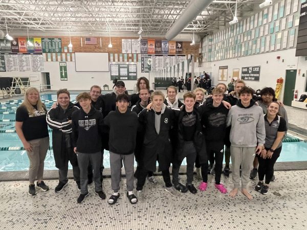 Above, the Normal West boys swim team celebrates their 6th conference championship at Peoria Richwoods High School on Saturday, February 8.
