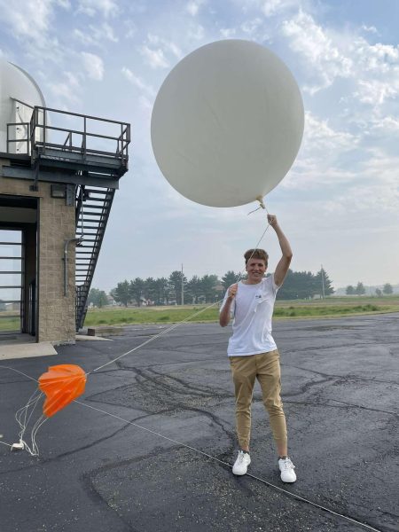 Tyler Hoss has turned an interest in weather into a potential career. Hoss created his own audience through social media, where he shares his forecasts with people on Snapchat and Instagram. Above, Hoss poses with one of his weather balloons.