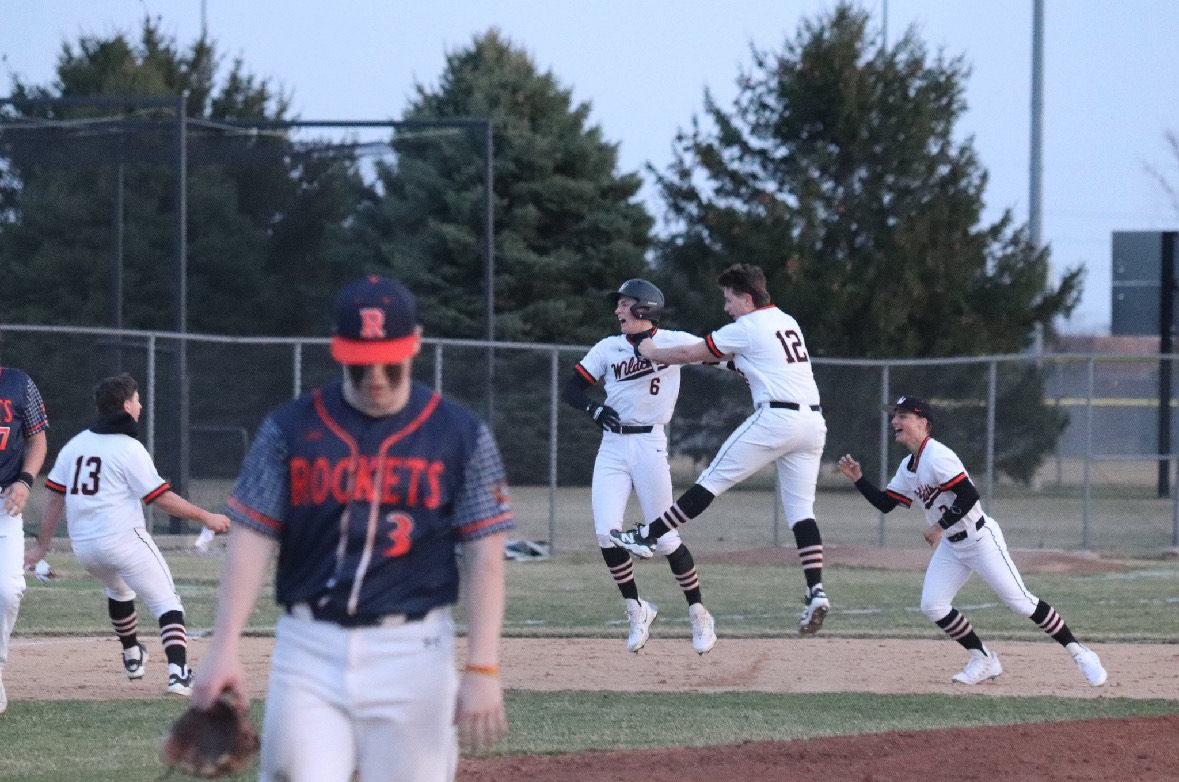 Senior Torin DeLaere is mauled by his teammates after hitting a walk-off double against a tough Rochester team on Tuesday, March 18. The Wildcats have started off hot with a 3-0 start before heading to Alabama for their annual spring break trip.