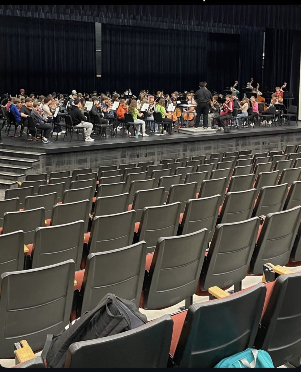 The Normal West High School orchestra prepares in rehearsal for their upcoming performance on Thursday, October 30. This year's Hauntcert will be themed as 