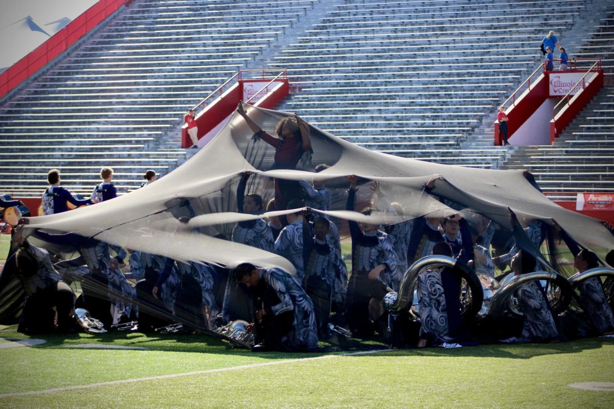 Normal Marching Band performing their 2025 production, "Monsters of Our Own Creation." Ryan Budzinksi is proud to see the growth and effort all marching band members over the 2025 season.