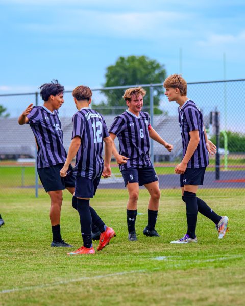 The Normal West boys soccer team has had a strong season and looks to continue to build on their success into the postseason. Above, junior Juan (Nacho) Arias, sophomore Kaleb McMorris, junior Charlie Hanks, and junior John Jasker gather in celebration, as they've been able to do a lot this season!