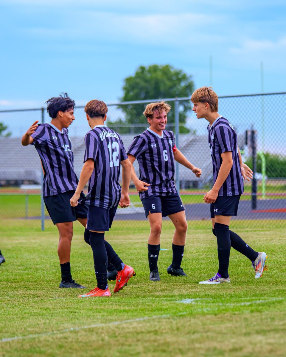 The Normal West boys soccer team has had a strong season and looks to continue to build on their success into the postseason. Above, junior Juan (Nacho) Arias, sophomore Kaleb McMorris, junior Charlie Hanks, and junior John Jasker gather in celebration, as they've been able to do a lot this season!