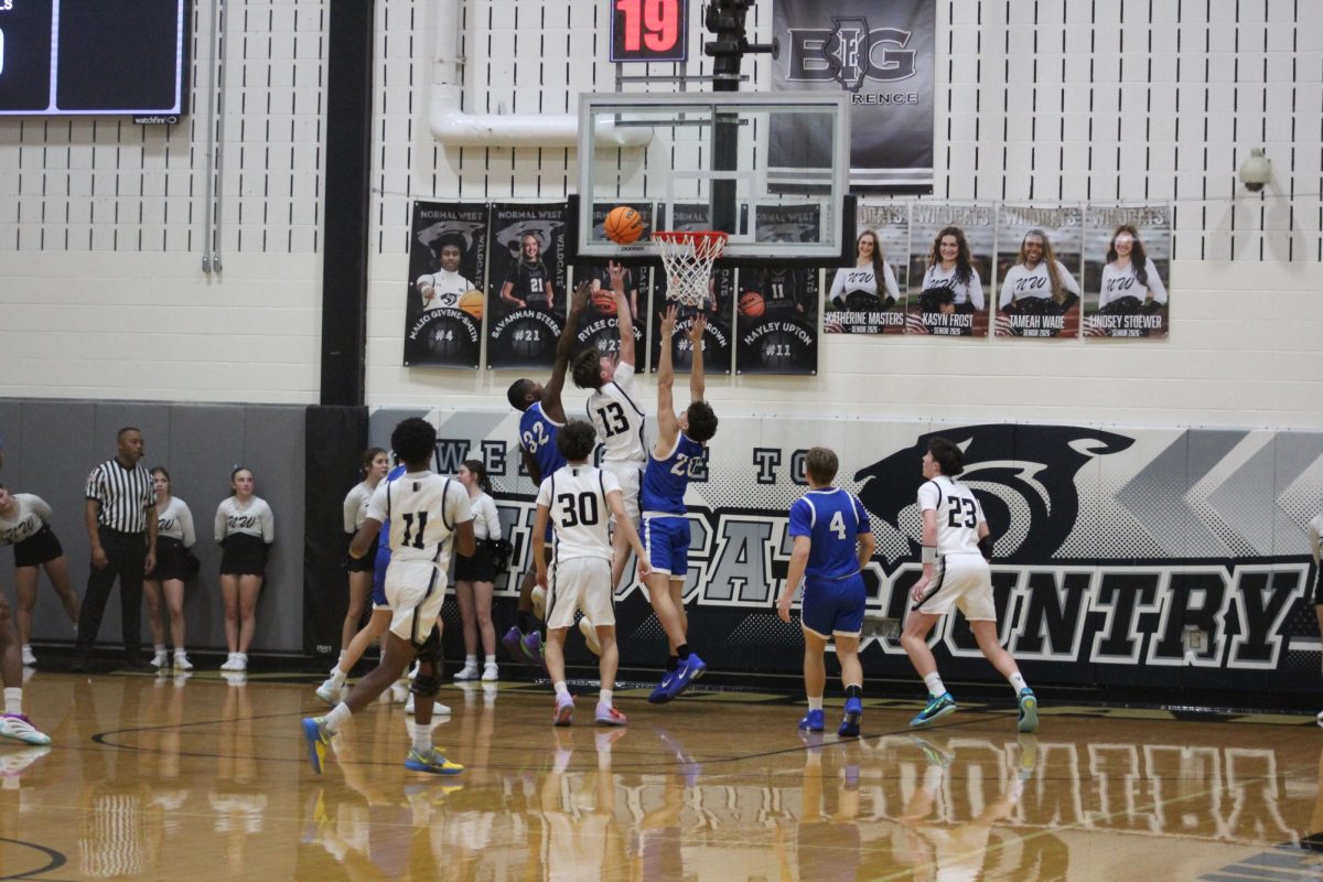 Sophomore Chase Sennett gets the put-back in Wednesday's matchup against Limestone High School. Sennett has been one of many Wildcats who've had to take on a new role on the basketball court this season. With a tough 0-6 start to the season, the Wildcats are still searching for their first win.