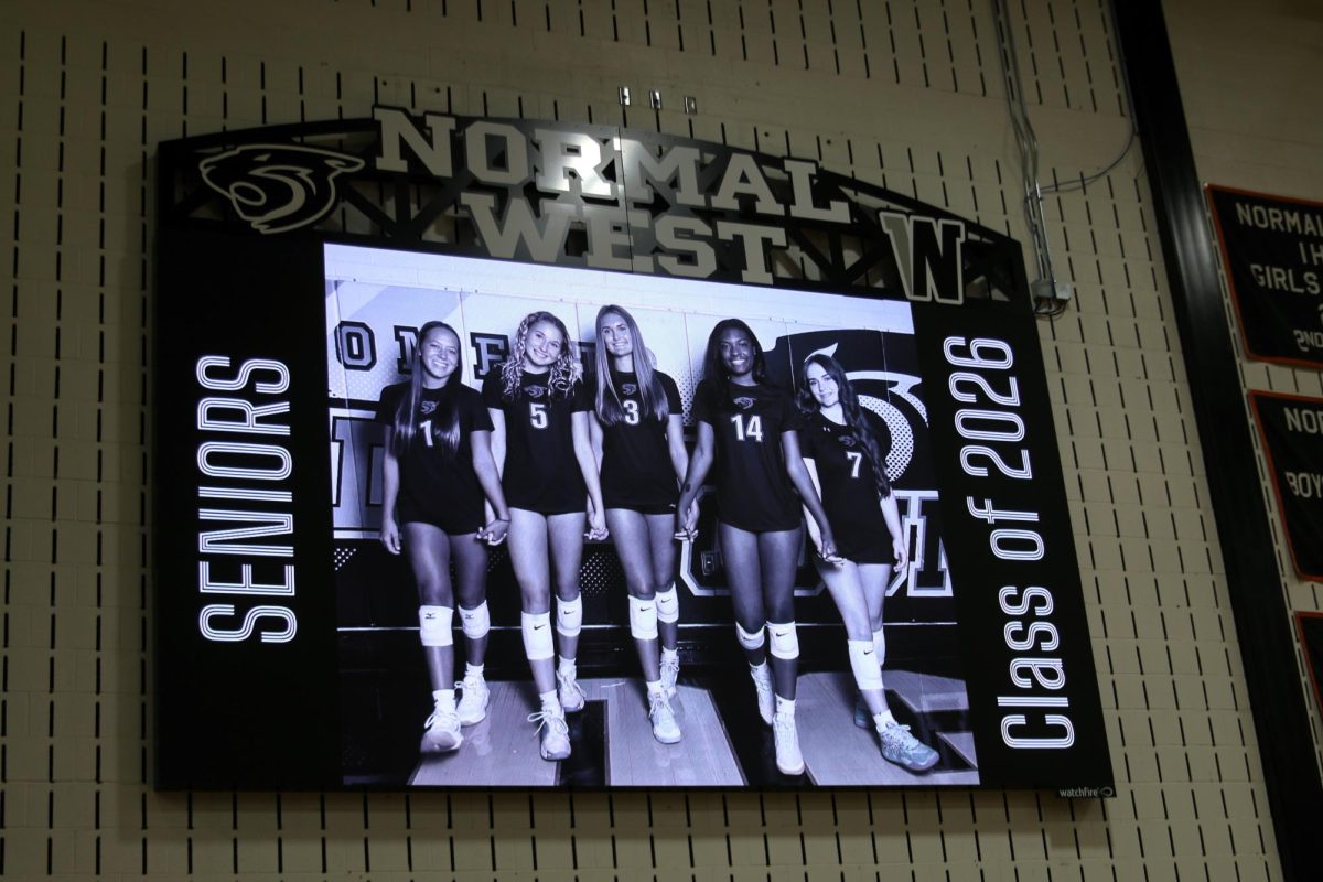 The addition of the videoboards in the main gym have added extra excitement to Normal West. Above, the volleyball team utilized the board to showcase their seniors on senior night.