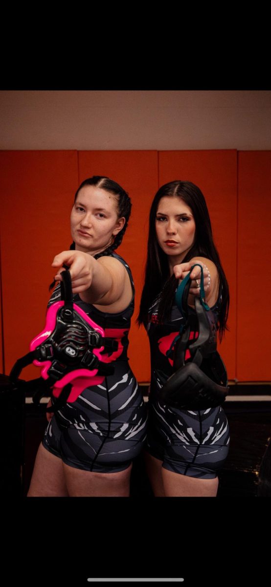 Seniors Emma Lundy and Amelia McClure will be honored at tonight's (1/22) first-ever girls wrestling dual meet. In addition to the meet, the growing program will honor alumni and wear pink to support the seniors.