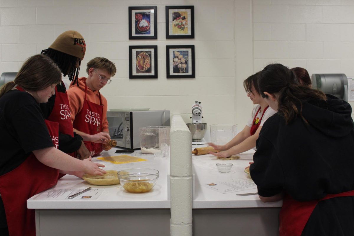 The Normal West FACS department is key in giving students experience in the kitchen. Above, the students of a Culinary 1 course bake apple pies.
