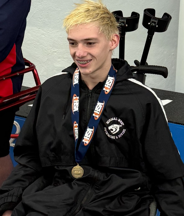 The Normal West boys swim and dive team's historic season was highlighted by a remarkable performance from freshman Ethan Rocke, who competed in the IHSA Athletes With Disabilities (AWD) division. Rocke (above) won four state titles in the 50-yard freestyle, 100-yard freestyle, 200-yard freestyle, and 100-yard breaststroke, becoming the first IHSA AWD state champion in Normal West history.